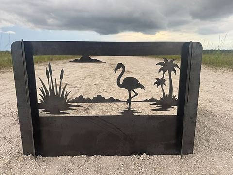 Steel panel cut with a flamingo, cattails and palms in an Everglades scene