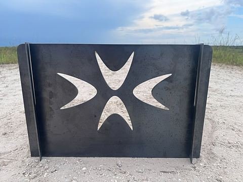 Steel panel cut with a Maltese cross
